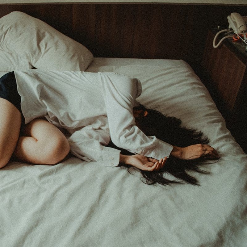 Woman sleeping in depression