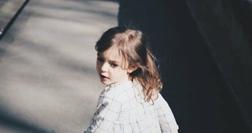 little girl looking back