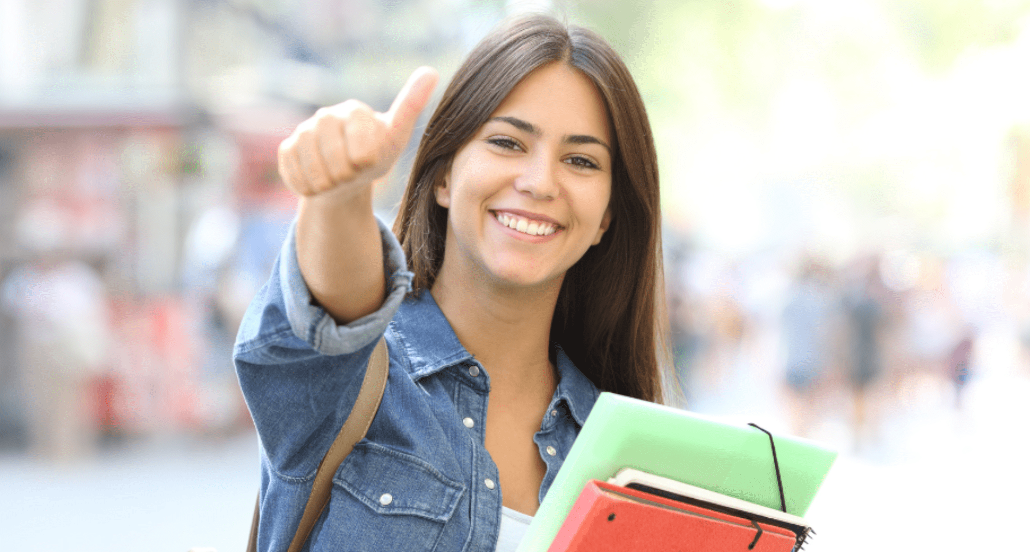 student girl giving thumbs up