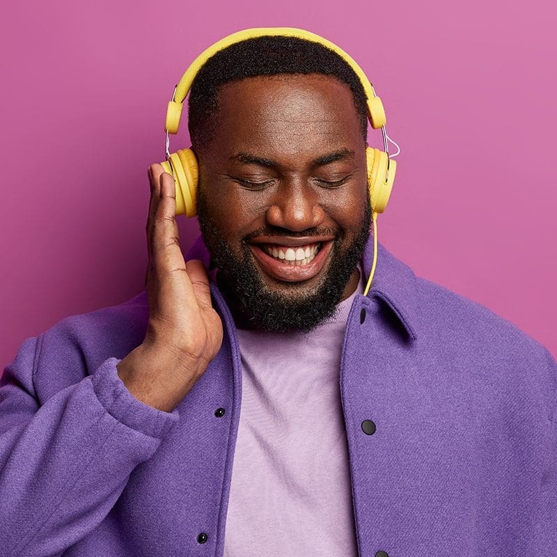 african american man listening music on headphones african american man listening music on headphones