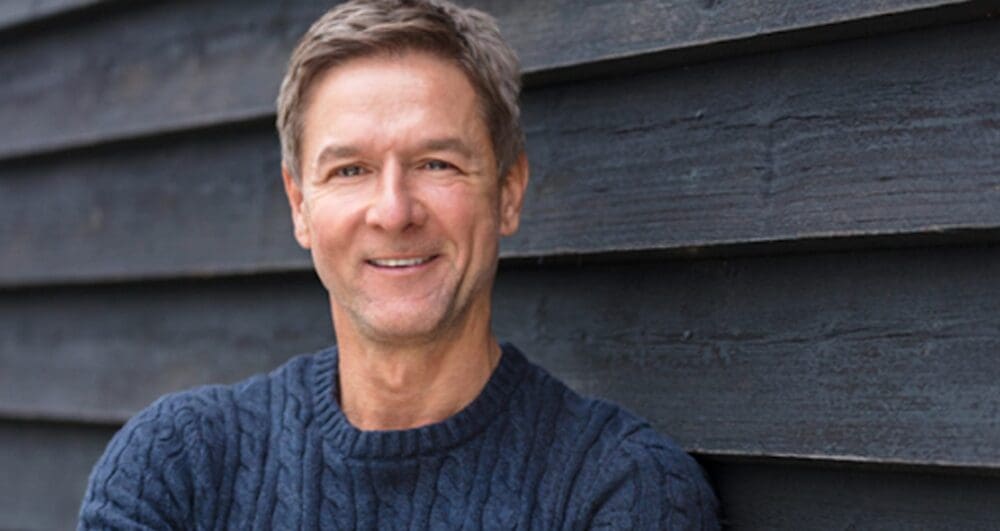 man smiling after finding Grey Matters