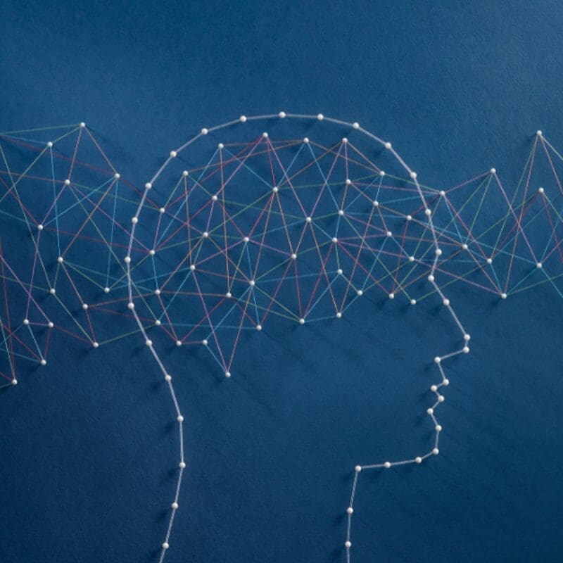 needle artwork of person and brain waves needle artwork of person and brain waves