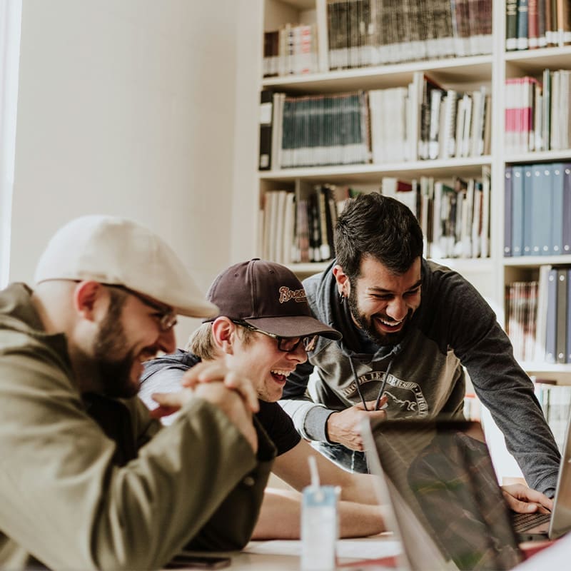 3 guys working and laughing