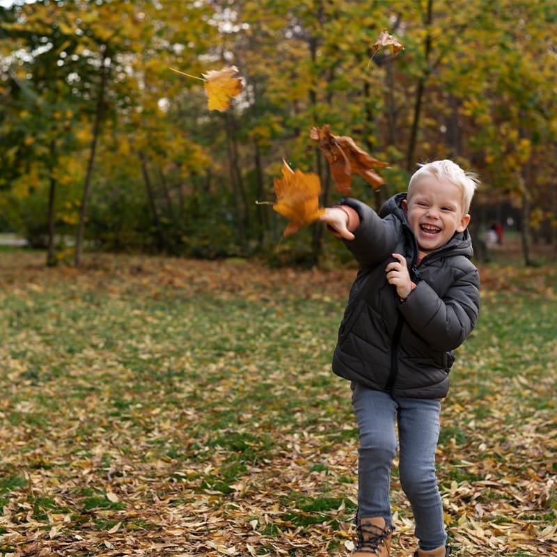little boy playing outside