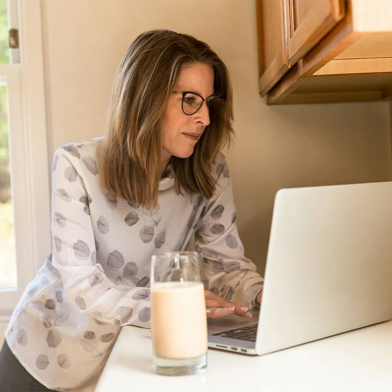 woman on computer at home woman using computer at home