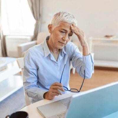 aged woman with overwhelmed with ADHD symptoms