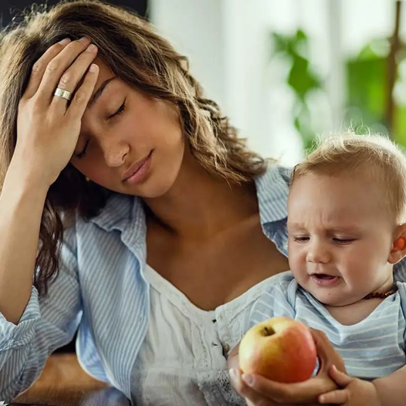 mom holding child, experiencing postpartum depression 2.0