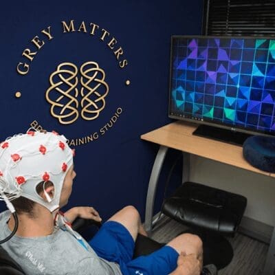 Boy receives brain training with Grey Matters Brain Training Studio in Carmel Indiana with visual on-screen display